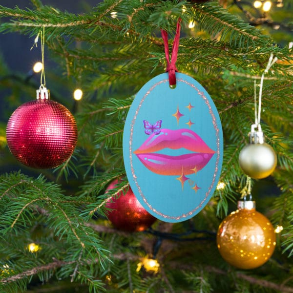 wooden oval ornament hanging on tree celebrate queen sky blue