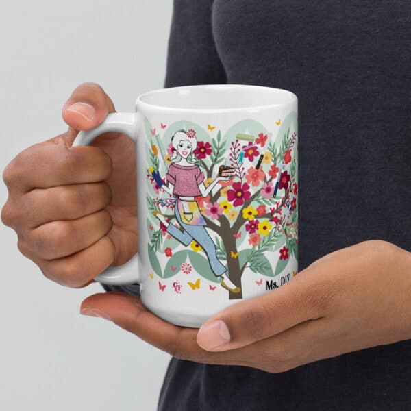 graphic-glossy-mug-white-15-oz-handle-on-left-holding-ms-diy.